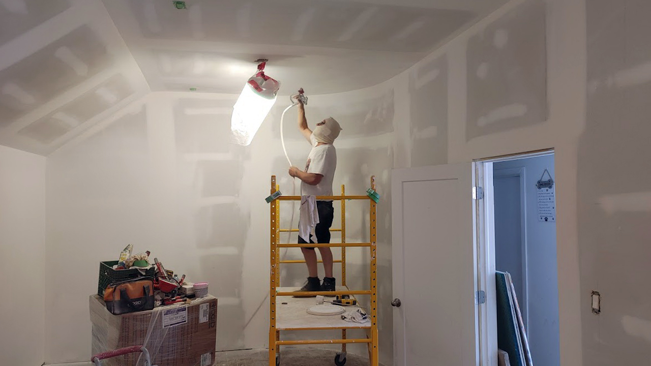 All walls were primed by sprayer for smoothness.